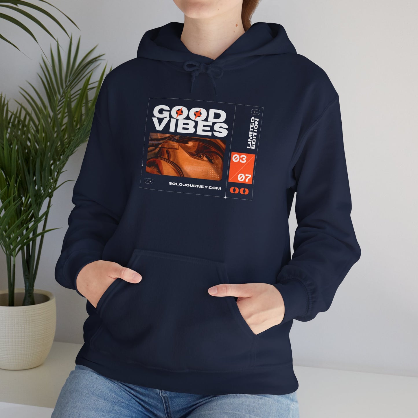 Good Vibes Unisex Heavy Blend Hoodie showcasing eco-friendly organic cotton, perfect for comfort and style.