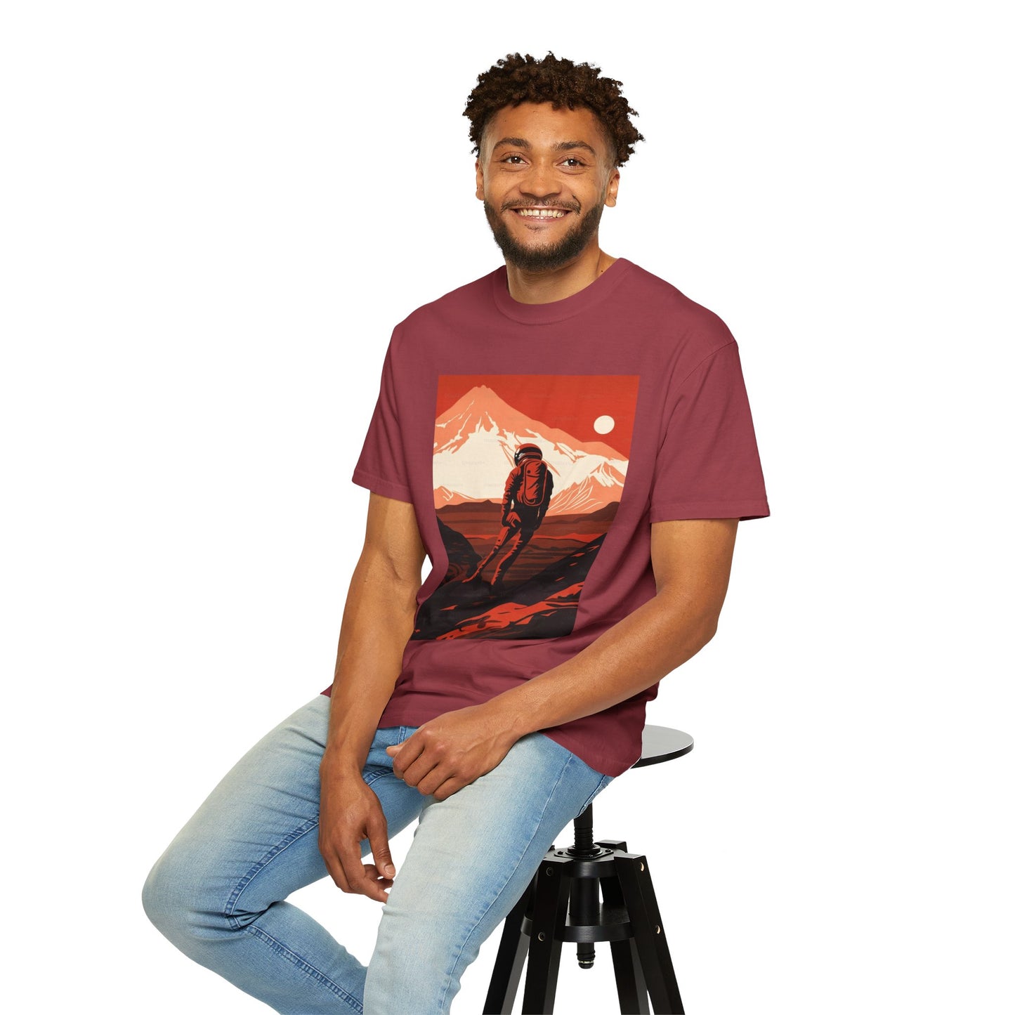 Casual lifestyle shot of the Man On Mars Graphic T-Shirt - Eco-Friendly Organic Cotton, Oversized Unisex Boho Tee worn outdoors.