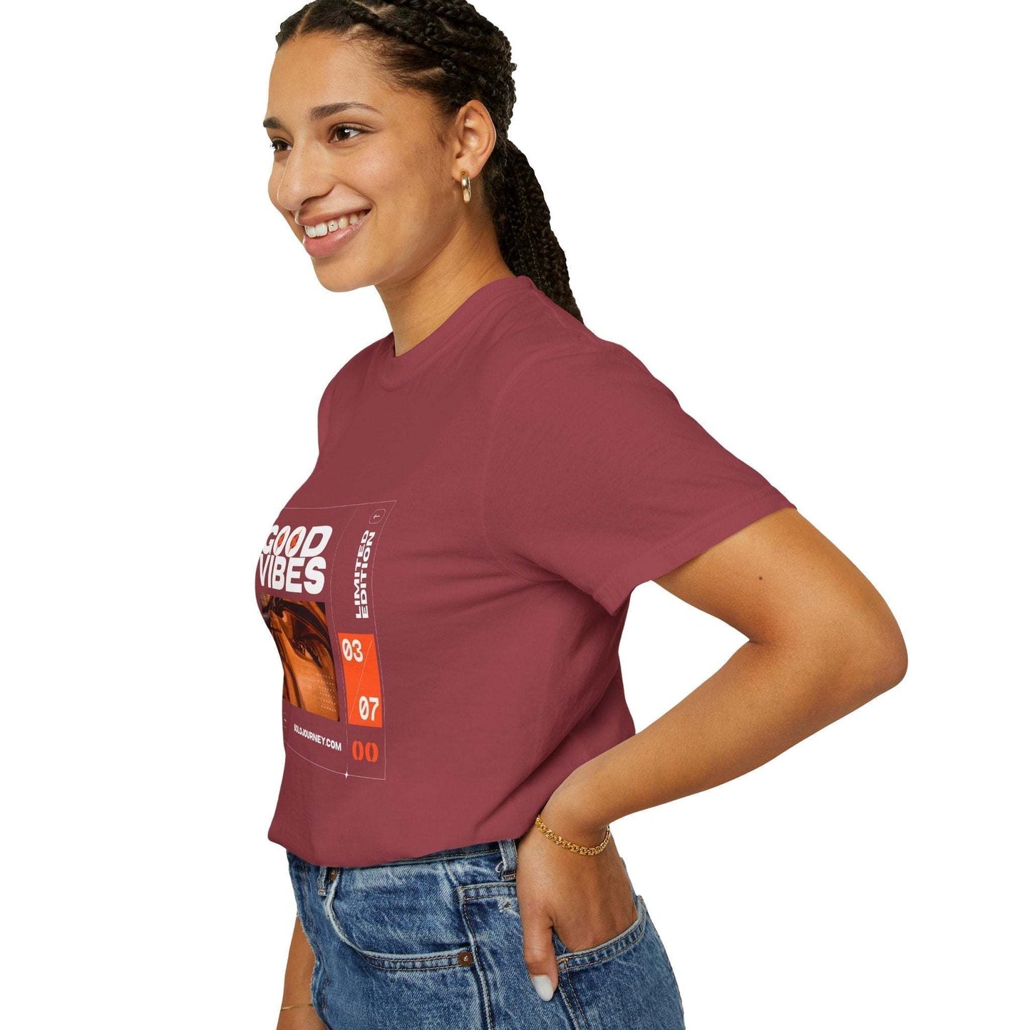 Good Vibes Graphic Design Pullover - Vintage Boho Oversized T-Shirt in Organic Cotton displayed on a hanger, showcasing its unique graphic print and oversized fit.