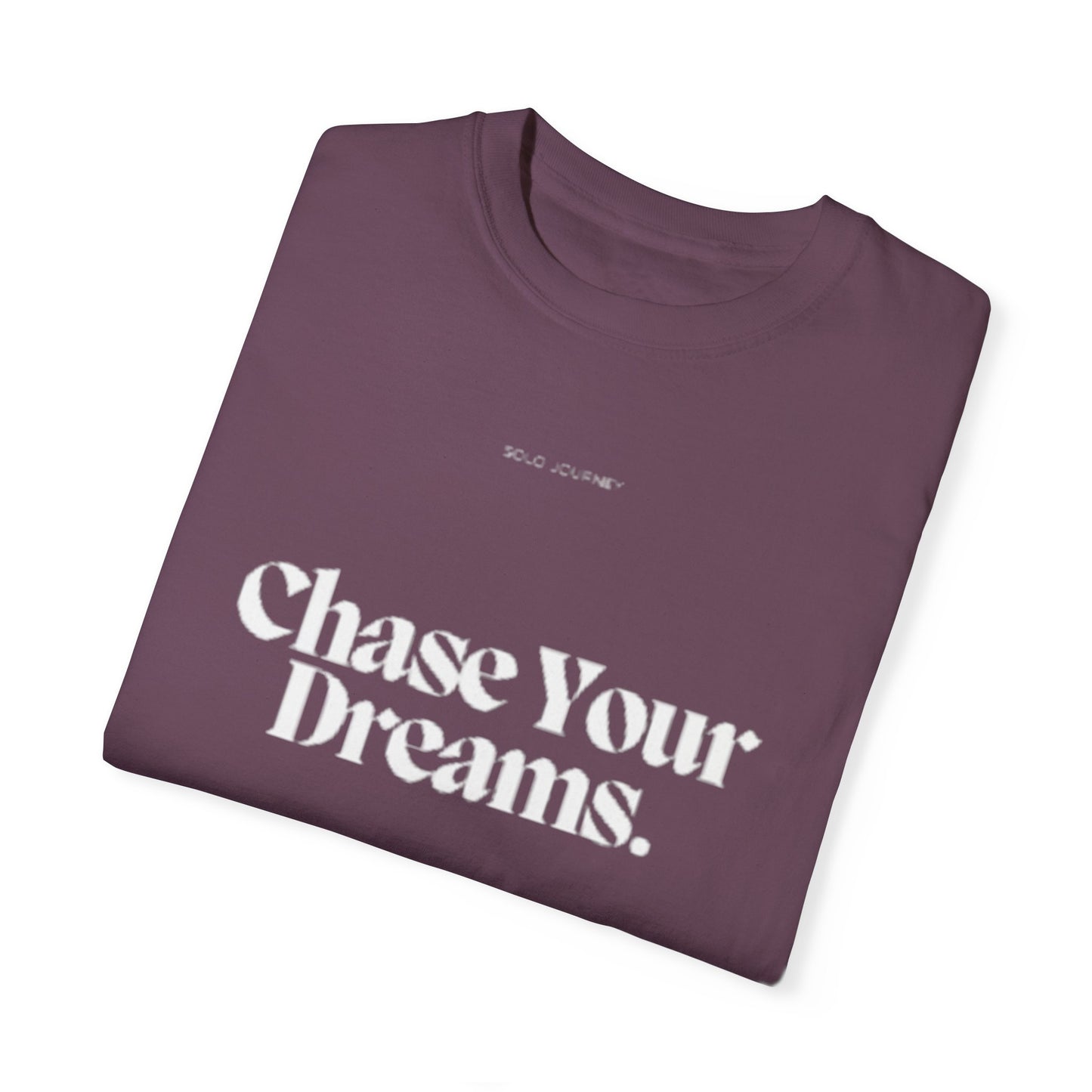 Chase Your Dreams Vintage Aesthetic Pullover displayed against a nature backdrop, emphasizing its commitment to eco-friendly fashion and unique artistic graphics.
