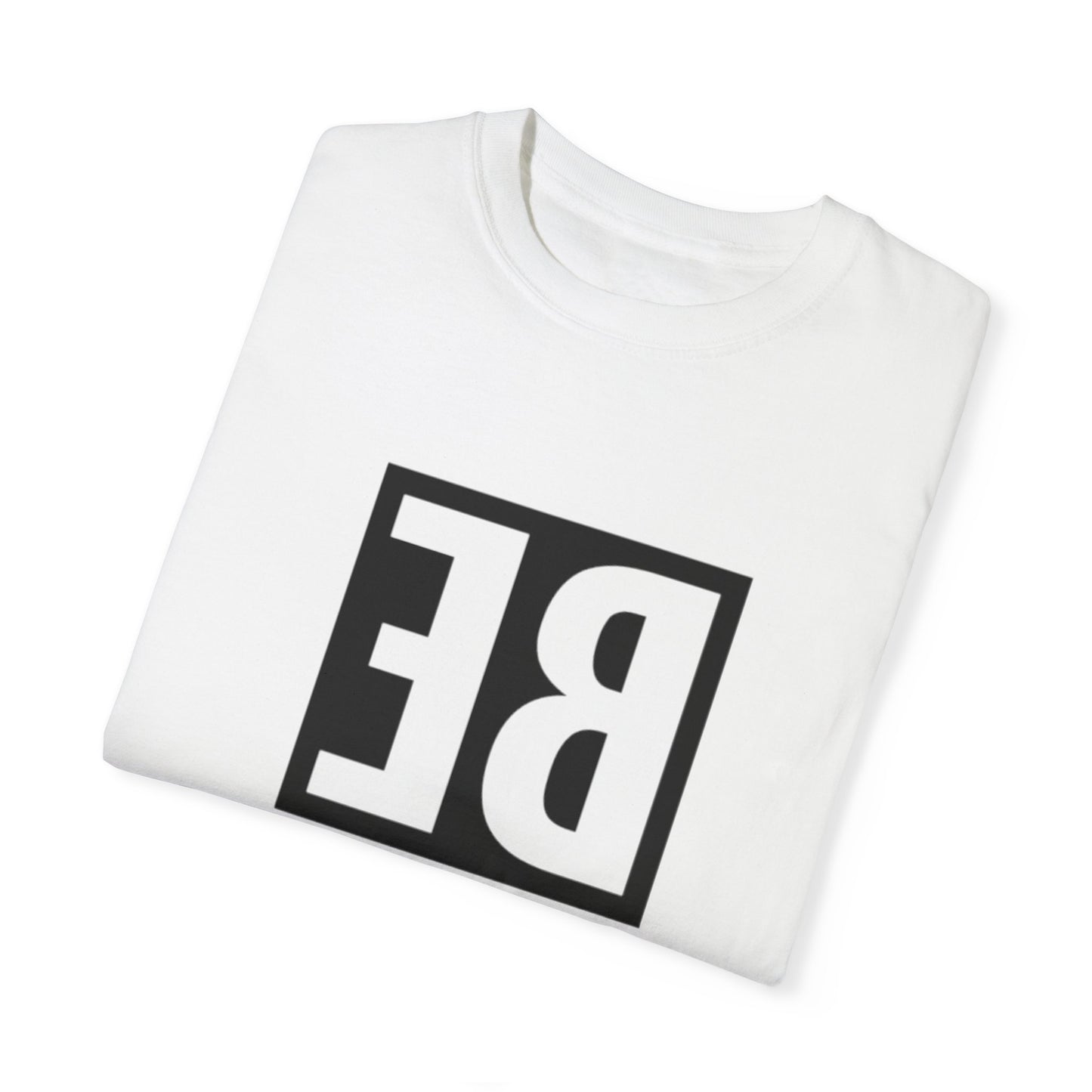 Flat lay of the Be Different Art Graphic Oversized Boho T-Shirt next to eco-friendly accessories, perfect for sustainable fashion lovers.