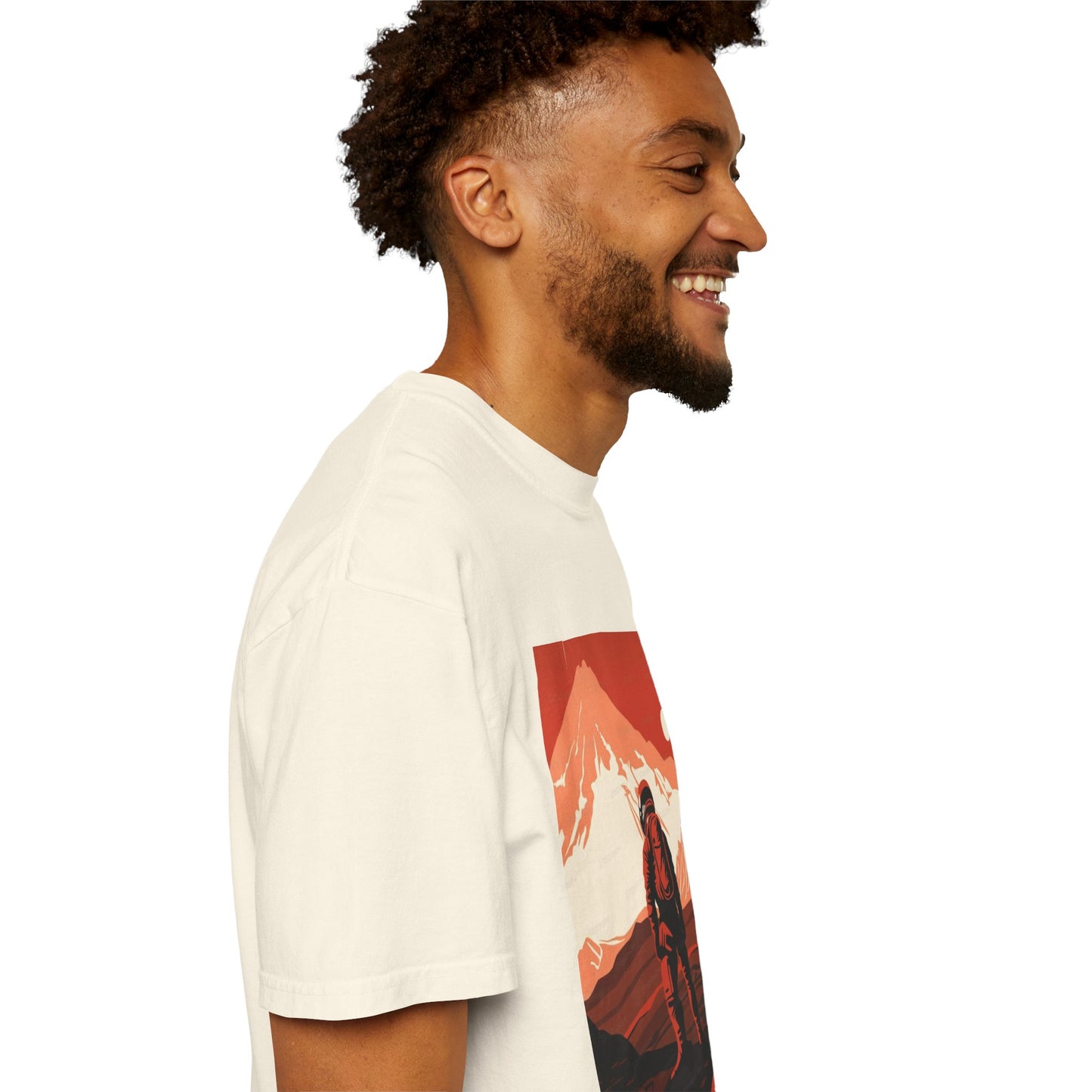 Flat lay of the Man On Mars Graphic T-Shirt on a wooden surface, demonstrating the soft texture and eco-friendly organic cotton fabric.