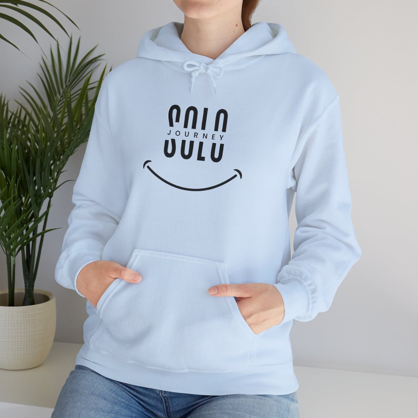 Model wearing the Solo Journey Oversized Boho Hoodie styled with jeans, an embodiment of affordable sustainable fashion.
