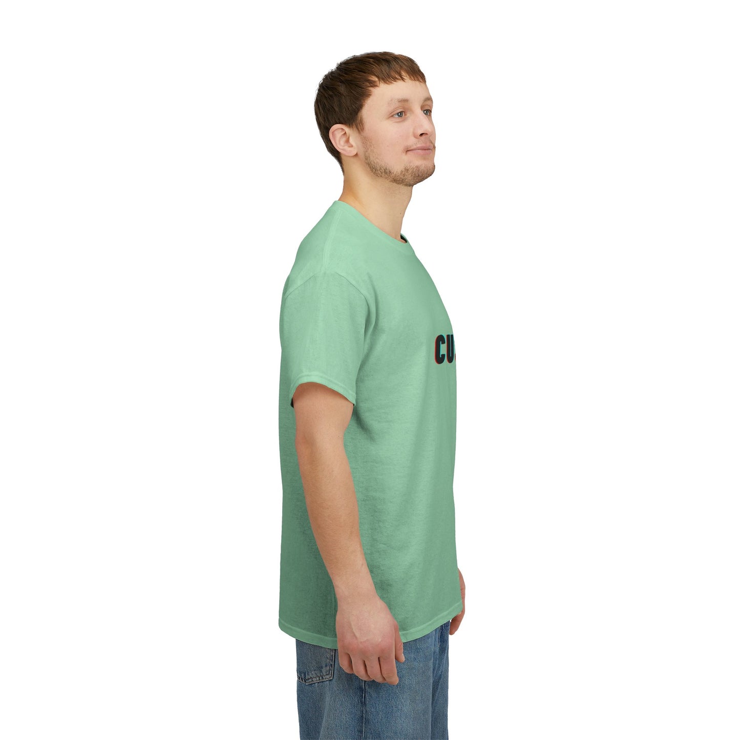 The Personalized Unisex Heavy Cotton Tee - Eco-Friendly, Comfortable, Custom Graphic Wear in various colors laid flat on a wooden surface.