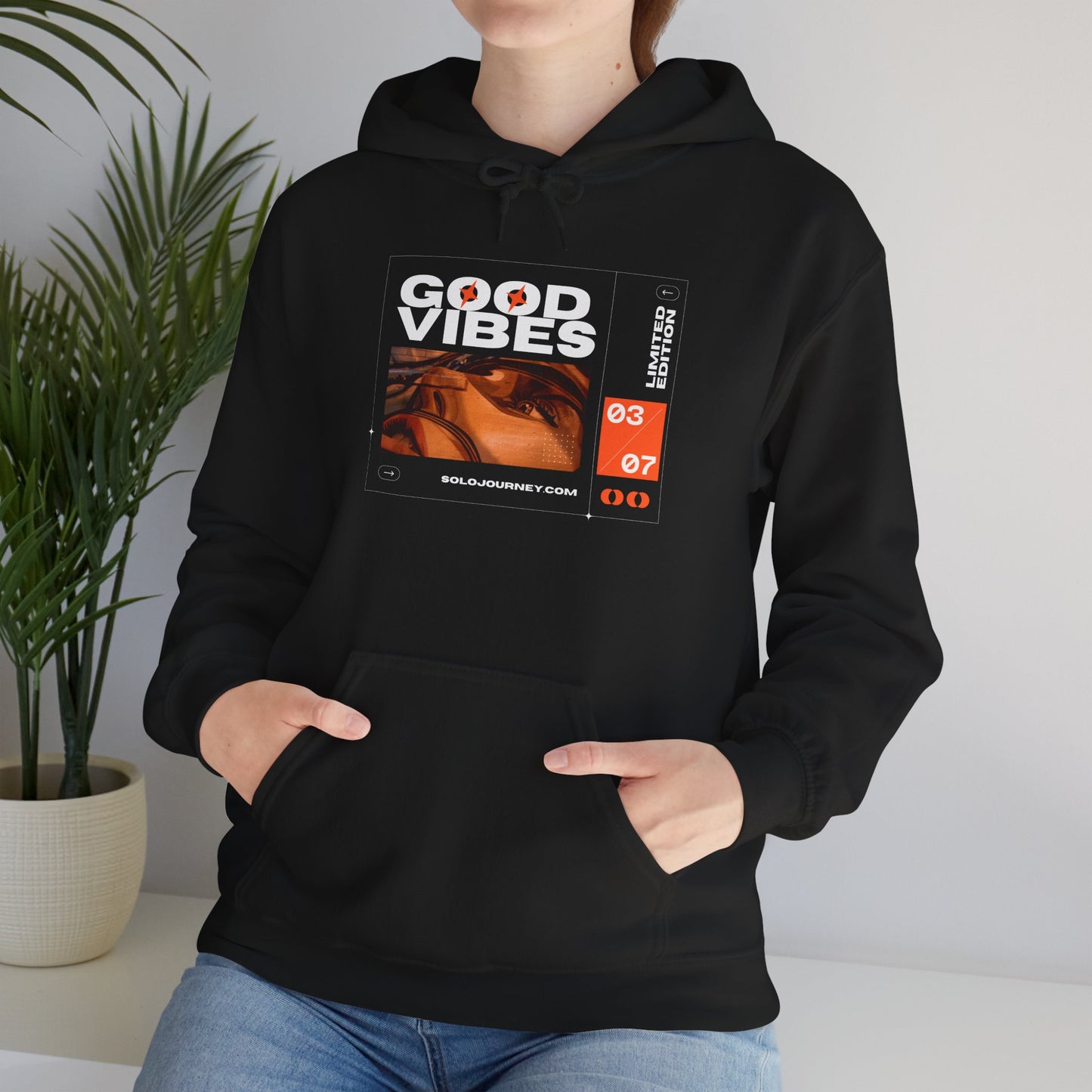 Good Vibes Unisex Heavy Blend Hoodie featuring eco-friendly organic cotton material for ultimate comfort and style.