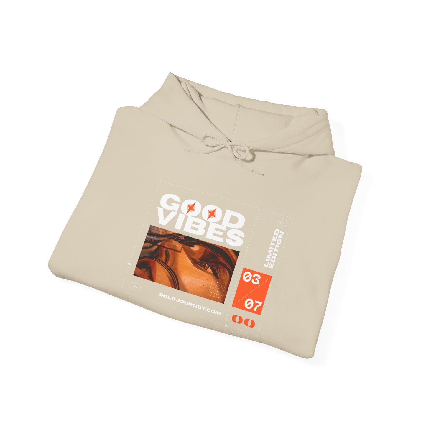 Close-up of the Good Vibes Unisex Heavy Blend Hoodie, showcasing its soft, breathable organic cotton fabric.