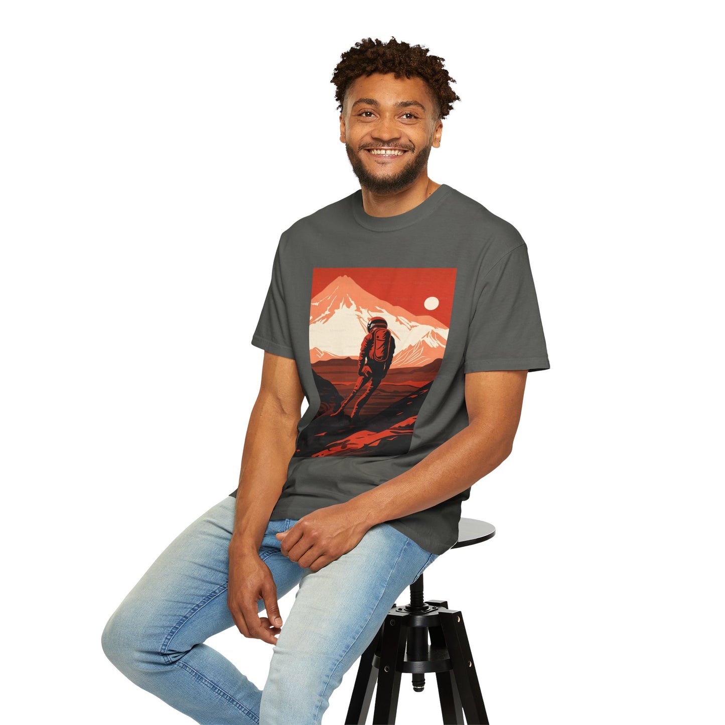 Flat lay of the Man On Mars Graphic T-Shirt styled with accessories, perfect for eco-conscious fashion lovers seeking a boho vibe.