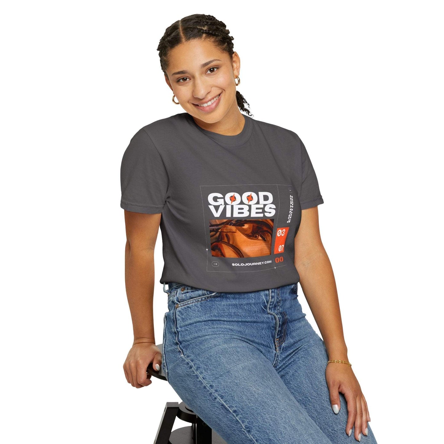 Good Vibes Graphic Design Vintage T-Shirt in a creative studio setting, perfect for those who embrace eco-friendly fashion.