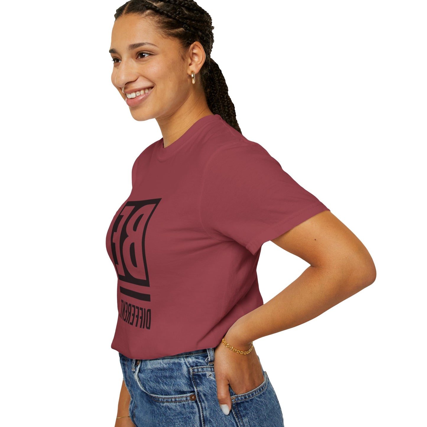 Flat lay of the Be Different Art Graphic Oversized Boho T-Shirt paired with jeans and accessories, emphasizing its versatility for casual occasions.