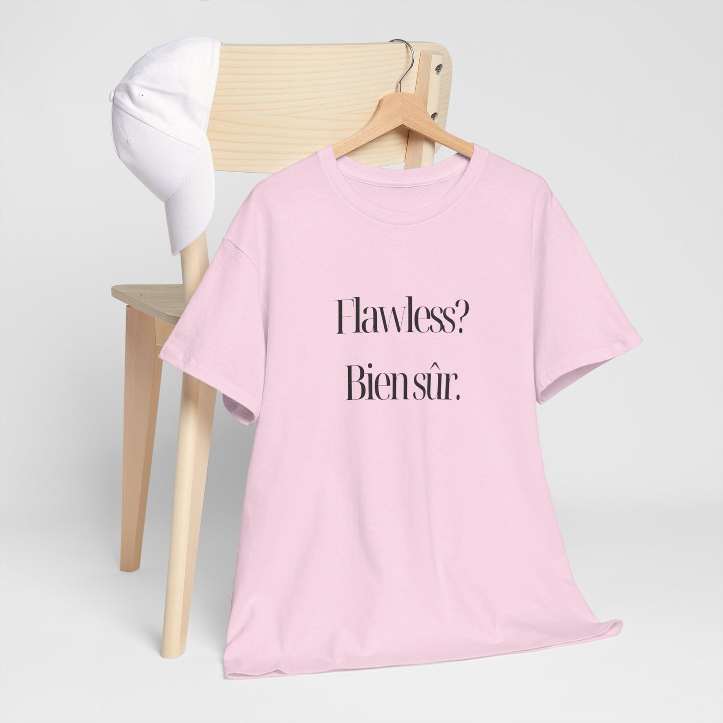 Flawless? Bien Sûr - Unisex Eco-Friendly Heavy Cotton Tee showcasing a playful graphic design on a model outdoors.