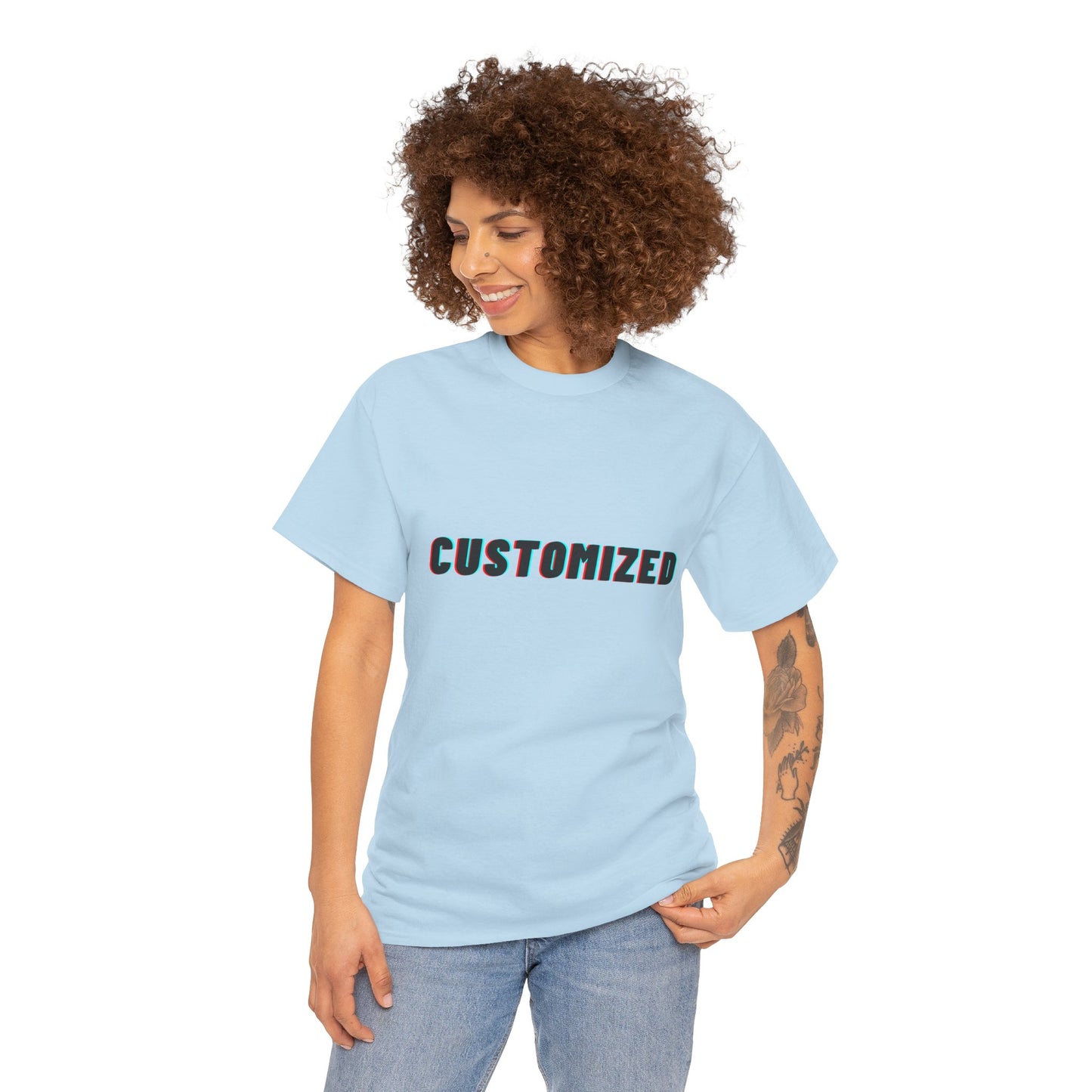 A flat lay of the Personalized Unisex Heavy Cotton Tee - Eco-Friendly, Comfortable, Custom Graphic Wear with nature-inspired graphics.