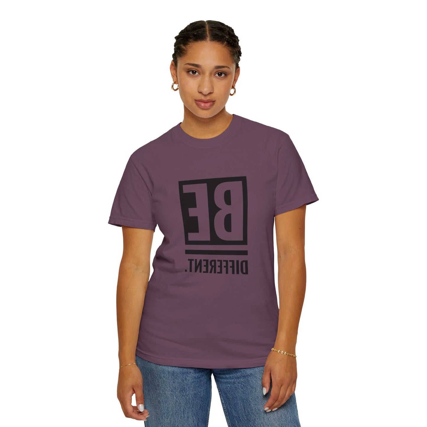 Be Different Art Graphic Oversized Boho T-Shirt displayed on a hanger, highlighting its relaxed fit and breathable fabric.