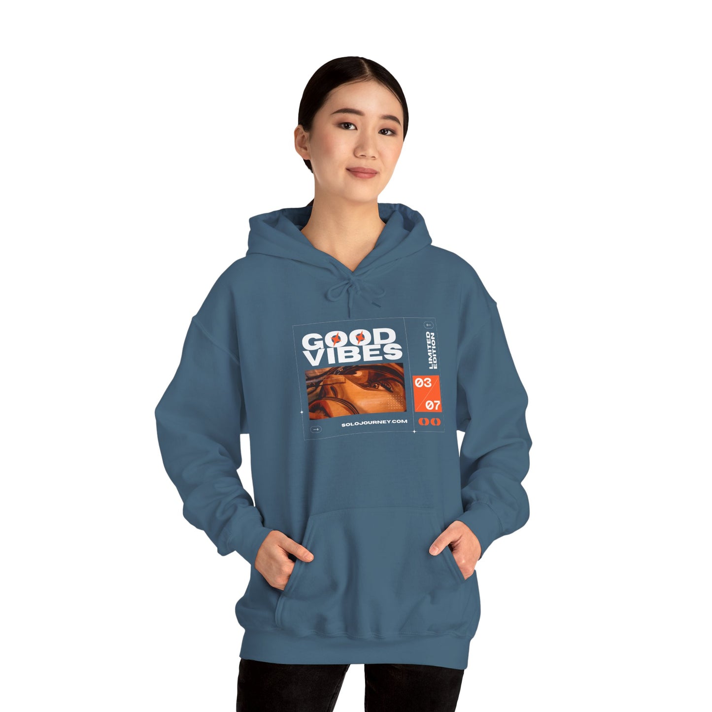 Close-up of the Good Vibes Unisex Heavy Blend Hoodie fabric, emphasizing the soft, hypoallergenic organic cotton texture.