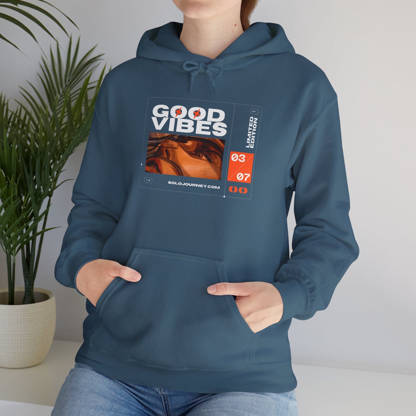 Front view of Good Vibes Unisex Heavy Blend Hoodie featuring eco-friendly organic cotton for comfort and style.