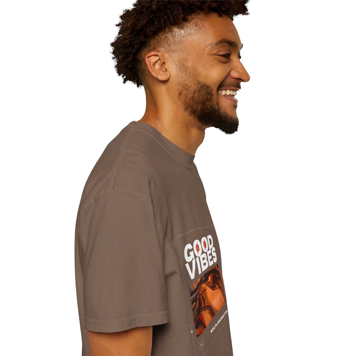 Good Vibes Graphic Design Pullover laid flat on a cozy knit blanket, showcasing the premium quality of organic cotton and its comfortable fit for everyday wear.