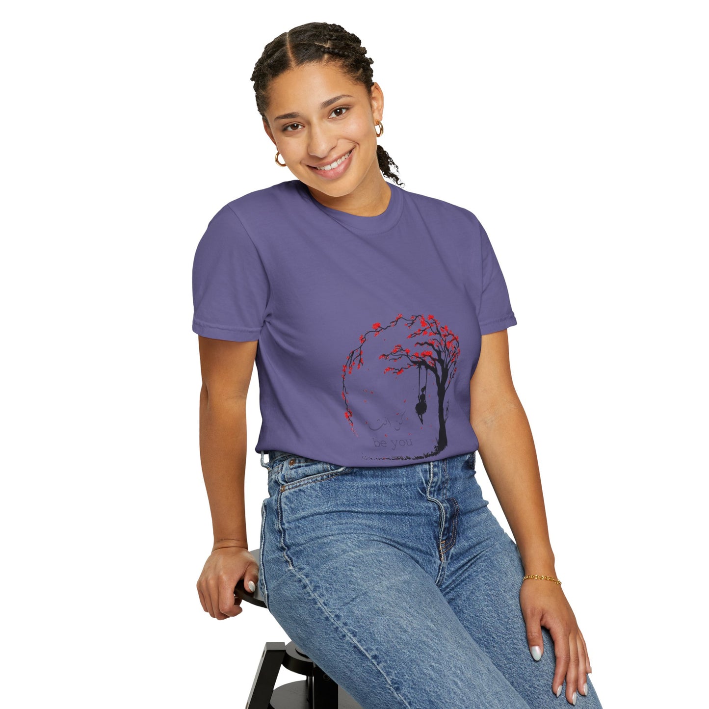 Flat lay of the Cherry Blossom Unisex T-Shirt, displaying its vibrant colors and unique graphic design, great for sustainable wardrobe choices.