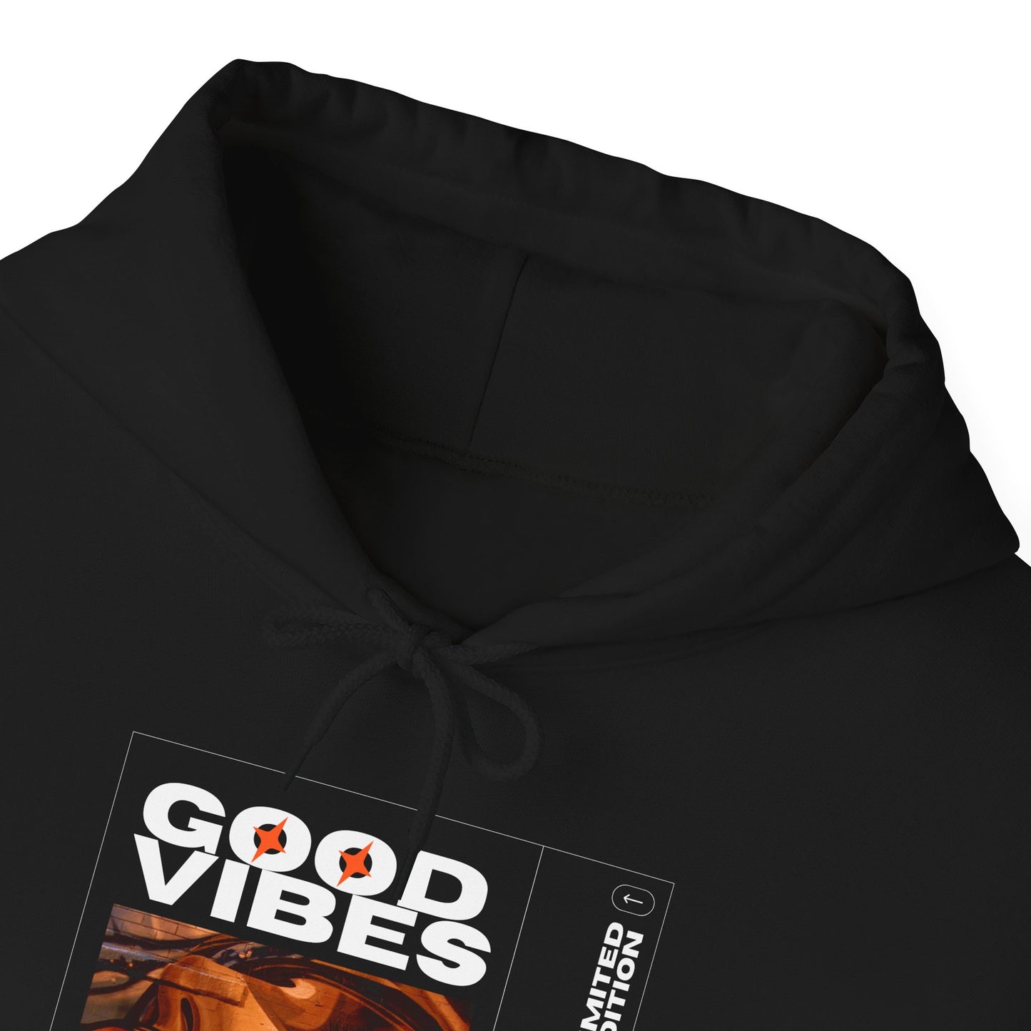 Close-up of the unique graphic prints on the Good Vibes Unisex Heavy Blend Hoodie, celebrating sustainable fashion and personal style.