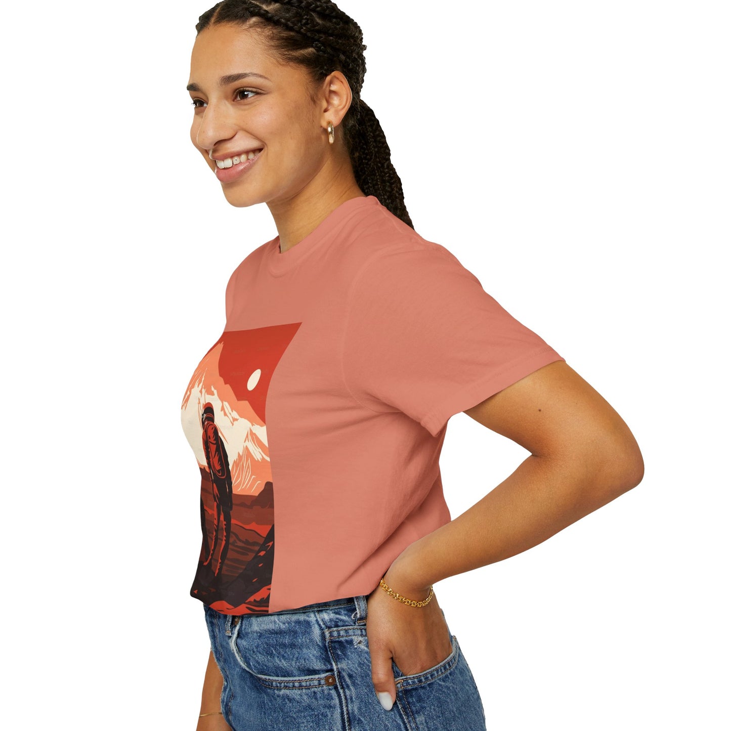 The Man On Mars Graphic T-Shirt laid flat on a surface, revealing its lightweight fabric and eco-friendly organic cotton material.