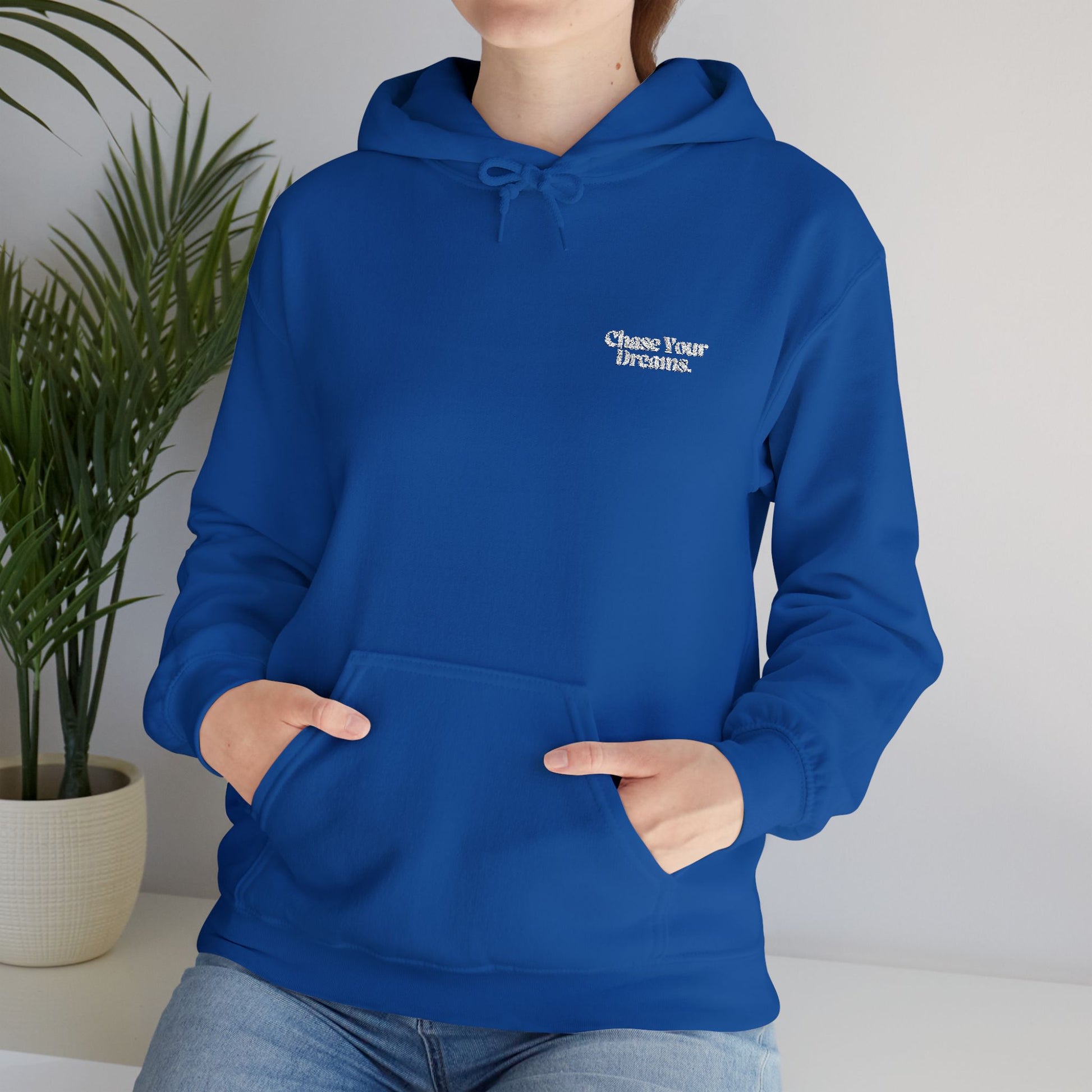 Chase Your Dreams Vintage Aesthetic Oversized Hoodie worn outdoors, emphasizing its versatility for casual outings and adventures.