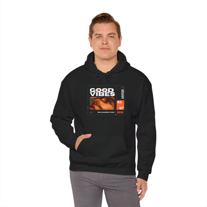 Good Vibes Unisex Heavy Blend Hoodie in action, emphasizing its relaxed fit and moisture-wicking properties for any activity.