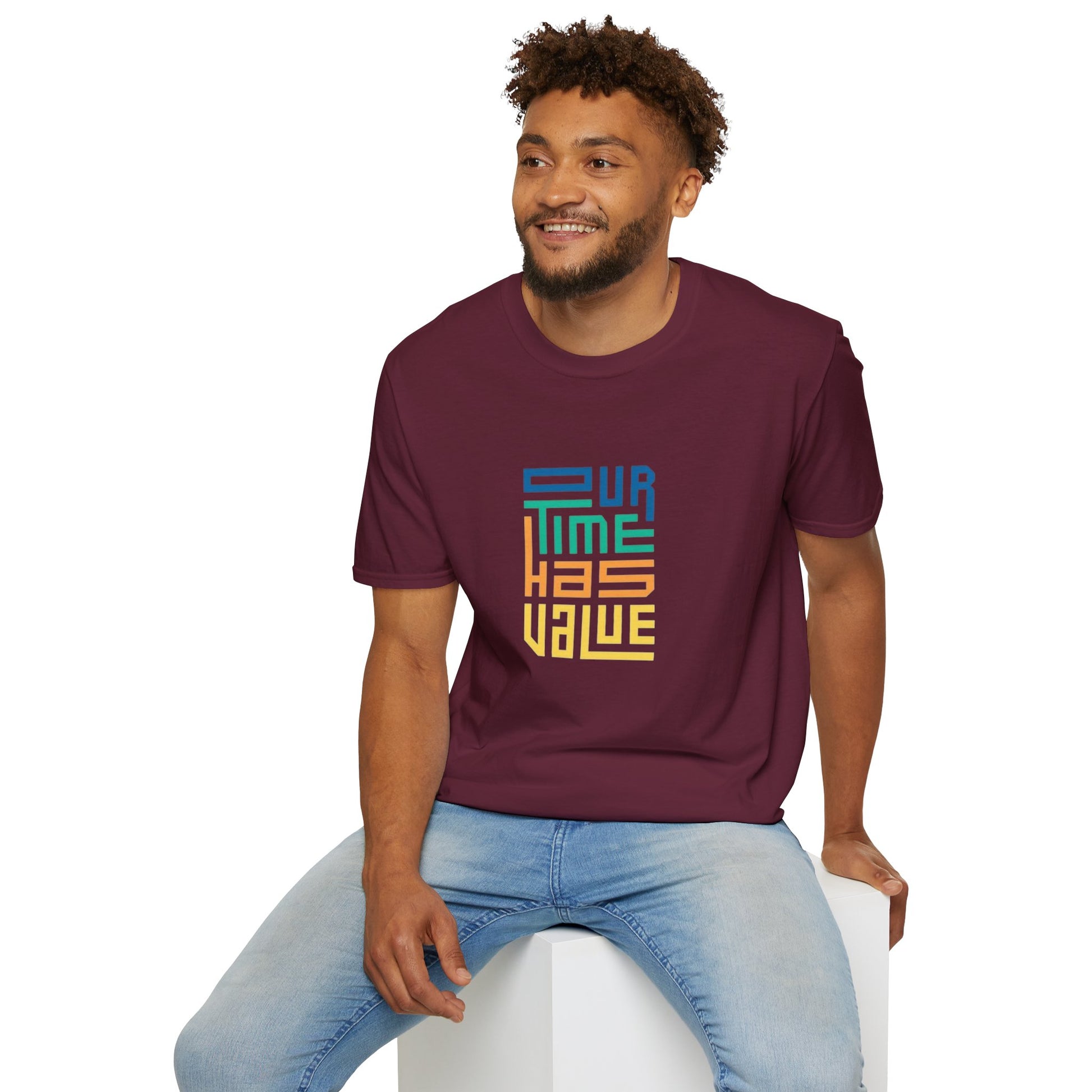 Our Time Has Value Unisex Softstyle T-Shirt displayed in a cozy setting, showcasing its stylish design and eco-friendly cotton material.
