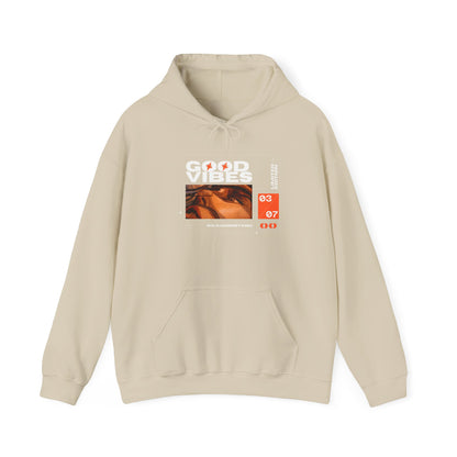 Good Vibes Unisex Heavy Blend Hoodie in eco-friendly organic cotton, showcasing a relaxed fit perfect for comfort and style.